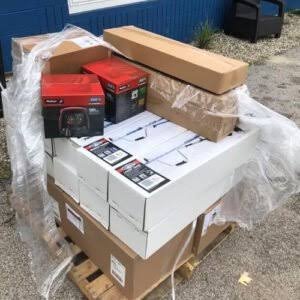 New pallets of assorted tools neatly packaged and stacked, ready for wholesale distribution or resale.
