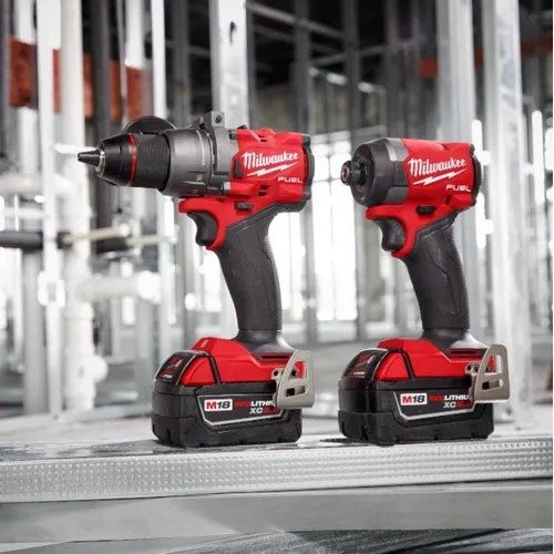 Milwaukee cordless drill and charger set, featuring a compact power drill with a battery pack and charging unit.